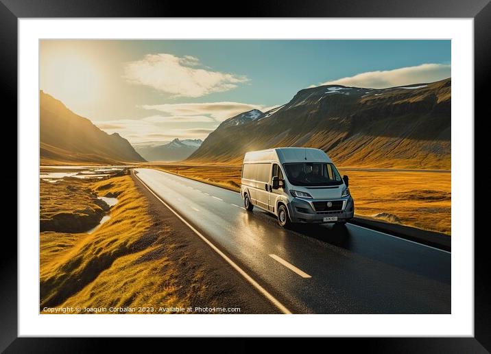 A campervan drives along a beautiful mountain road with snow-capped peaks, a family vacation adventure. Framed Mounted Print by Joaquin Corbalan