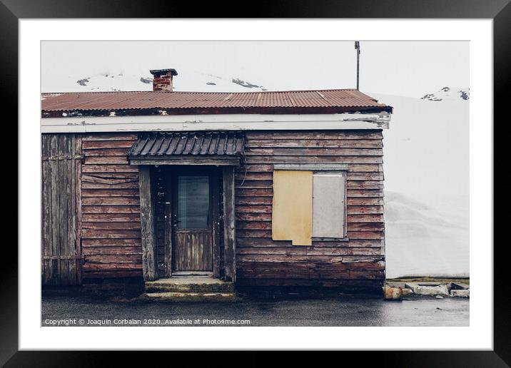 old house surrounded by snow Framed Mounted Print by Joaquin Corbalan