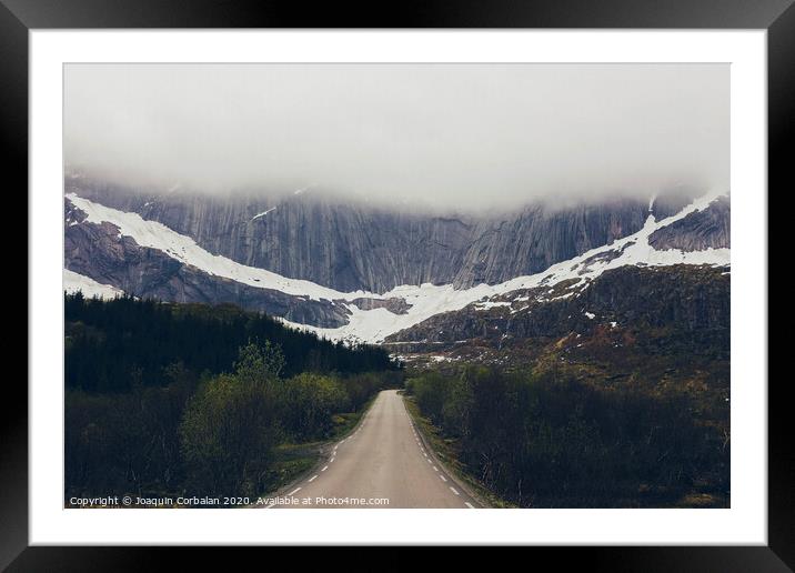 Challenging road to a rocky mountain with fog Framed Mounted Print by Joaquin Corbalan