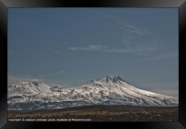 Snow-covered mountains in the Turkish region of Capaddocia. Framed Print by Joaquin Corbalan