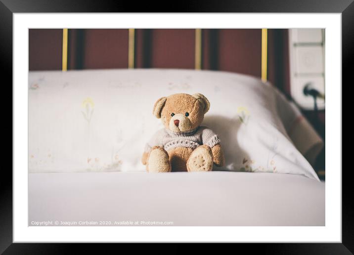 Teddy bear on the bed, space for text. Framed Mounted Print by Joaquin Corbalan