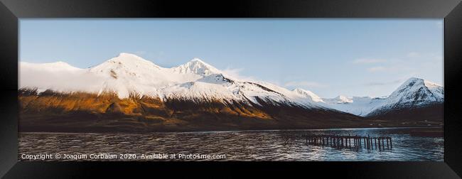 Beautiful scene of a landscape with high snowy mountains and sea. Framed Print by Joaquin Corbalan