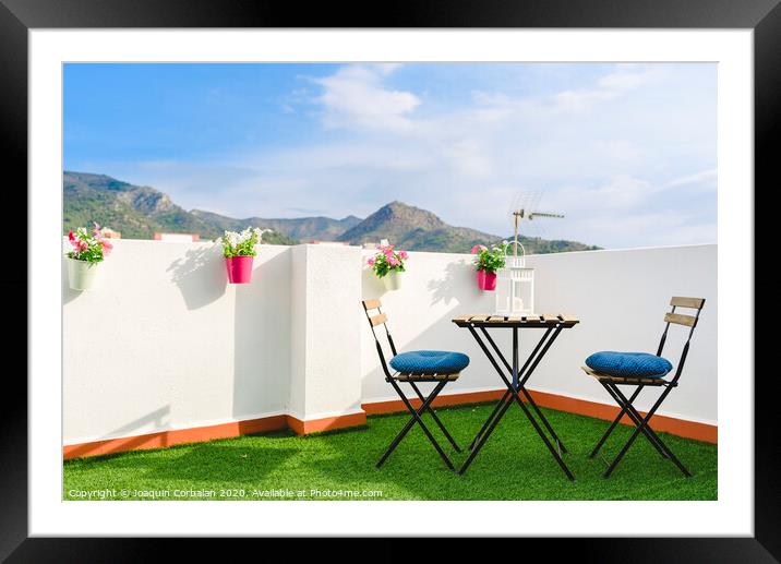 Beautiful white terrace with chairs and coffee table overlooking the Mediterranean mountain, blue sky. Framed Mounted Print by Joaquin Corbalan