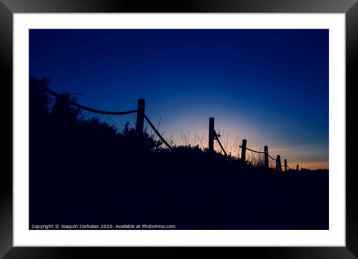 Cold sunset with silhouette of beach dunes Framed Mounted Print by Joaquin Corbalan