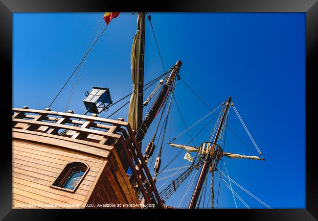 Stern of old galley docked in port to navigate the ocean in the discovery of America. Framed Print by Joaquin Corbalan