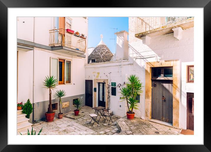 Facades of old Italian Mediterranean houses in Bari painted in colors. Framed Mounted Print by Joaquin Corbalan