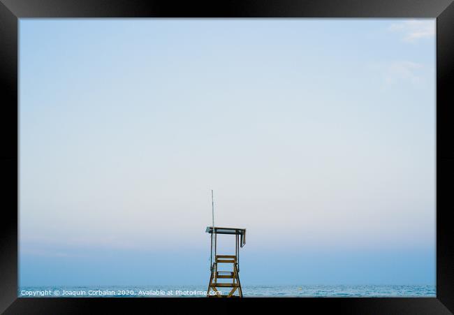 Lifeguard watchtower on the beach at sunset. Framed Print by Joaquin Corbalan