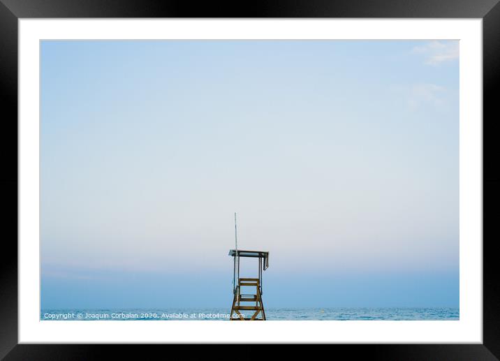 Lifeguard watchtower on the beach at sunset. Framed Mounted Print by Joaquin Corbalan