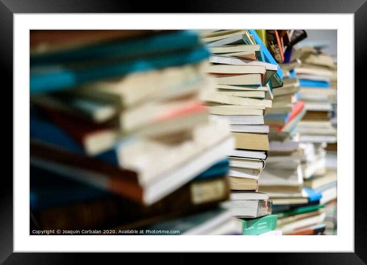 Pile of new and old books framed. Framed Mounted Print by Joaquin Corbalan