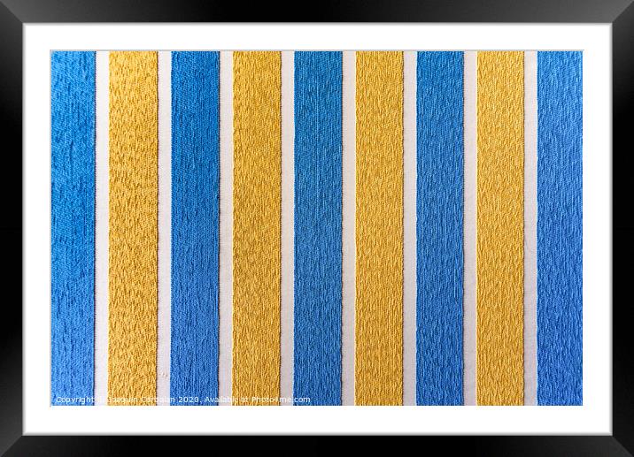 Strips of colored fabric cover a wall of carpet, decoration background. Framed Mounted Print by Joaquin Corbalan