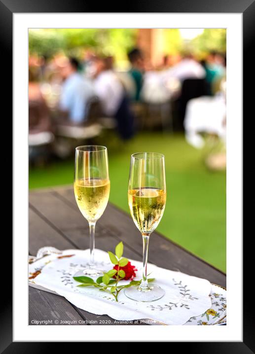 Pair of champagne glasses on a tray to celebrate the love of a couple. Framed Mounted Print by Joaquin Corbalan