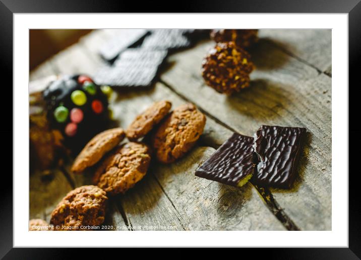 Chip cookies and chocolates pralines to take pleasure in Christmas holidays Framed Mounted Print by Joaquin Corbalan