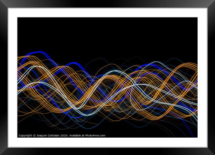 Colorful light painting with circular shapes and abstract black background. Framed Mounted Print by Joaquin Corbalan