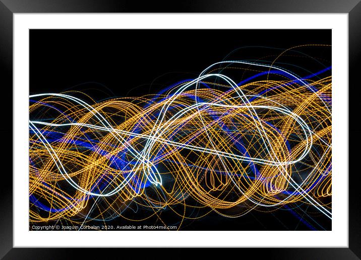 Colorful light painting with circular shapes and abstract black background. Framed Mounted Print by Joaquin Corbalan