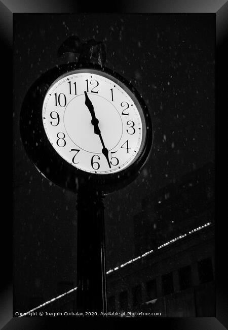 Street clock during a snowfall, time passes. Framed Print by Joaquin Corbalan