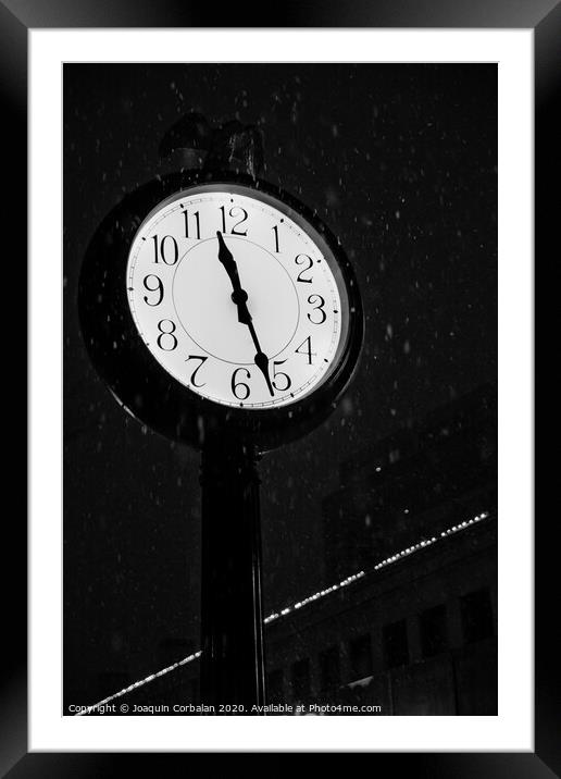 Street clock during a snowfall, time passes. Framed Mounted Print by Joaquin Corbalan