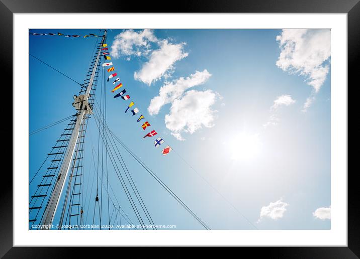 A classic sailboat moored to port Framed Mounted Print by Joaquin Corbalan