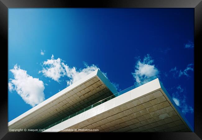 Blue sky background with clouds and a roof of modern financial business building. Framed Print by Joaquin Corbalan