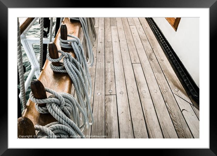 Ropes on a sailboat to tighten the sails of the ship during a cruise for tourists. Framed Mounted Print by Joaquin Corbalan