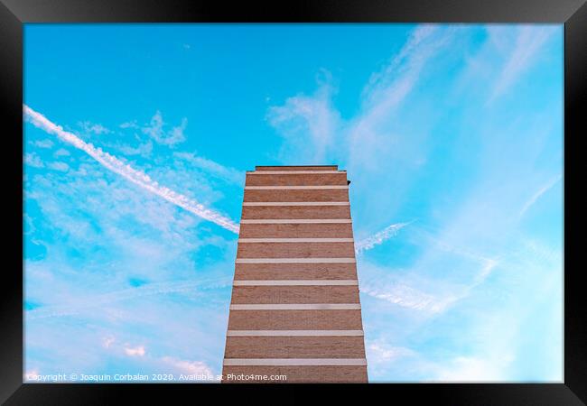 High housing building with blue sky in the background and copy space. Framed Print by Joaquin Corbalan