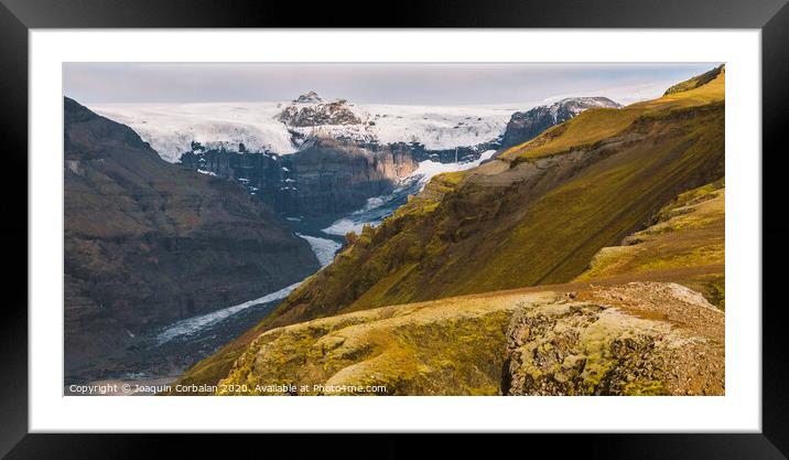 Huge glacier, view of the tongue and its large blocks of ice. Framed Mounted Print by Joaquin Corbalan