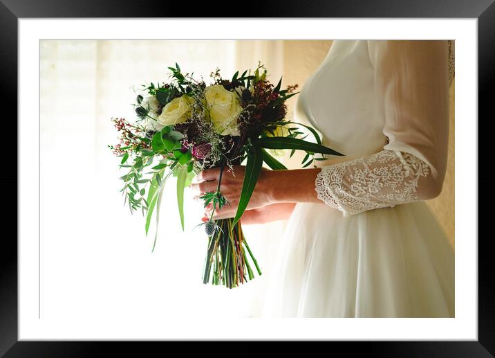 Bride holding her wedding bouquet Framed Mounted Print by Joaquin Corbalan