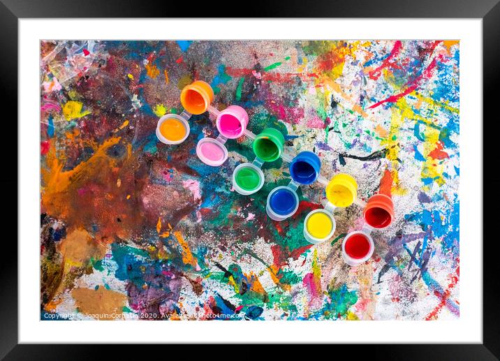 Bottles of paint of various colors to decorate plaster objects. Framed Mounted Print by Joaquin Corbalan