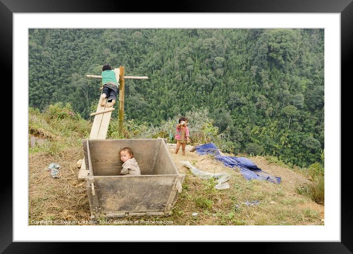 Children from villages in the mountainous area of ​​Sapa, north of Vietnam, expecting to see Western tourists. Framed Mounted Print by Joaquin Corbalan