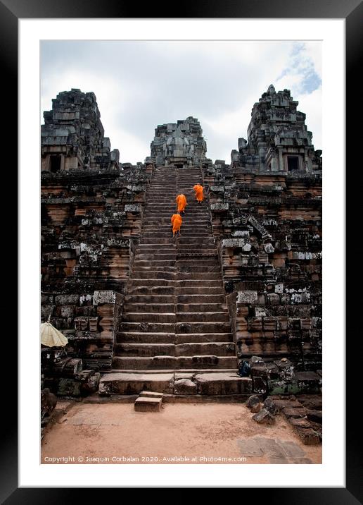 Buddhist monks meditating while walking through the Angkor Thom temple Framed Mounted Print by Joaquin Corbalan