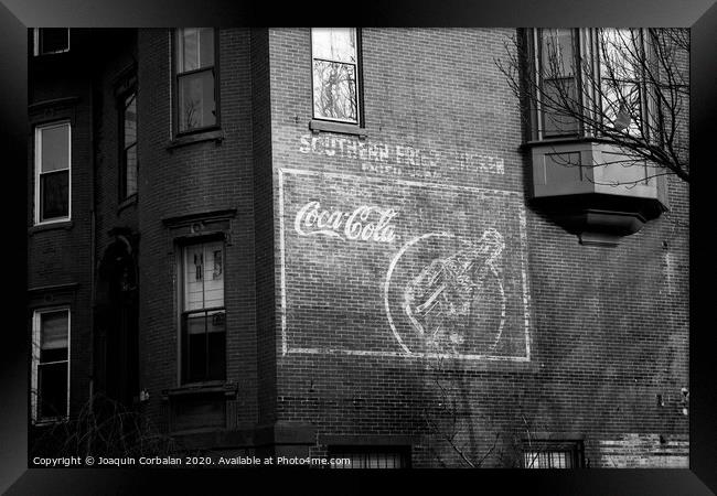 Old advertising poster of soda drink on the brick walls of a building. Framed Print by Joaquin Corbalan