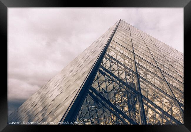 Crystal pyramid in Paris, sample of modern architecture on a cloudy day Framed Print by Joaquin Corbalan
