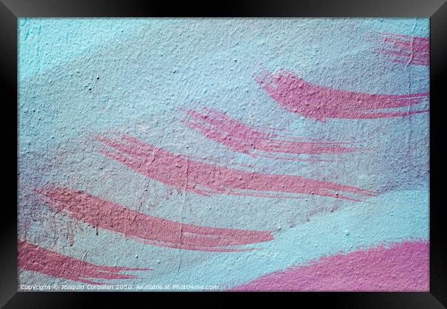 Pink brush strokes on blue painted wall. Framed Print by Joaquin Corbalan