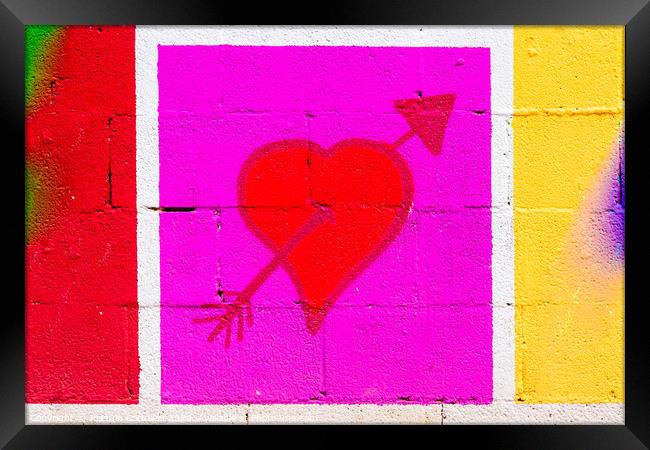 Heart pierced by a red arrow painted on a framed mural. Framed Print by Joaquin Corbalan