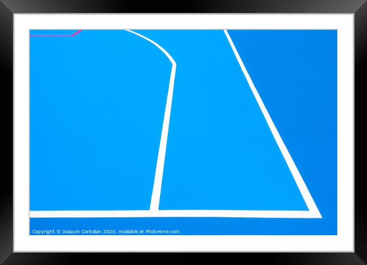 Intense blue background, from the floor of a basketball court to the midday sun, with straight lines and white curves. Framed Mounted Print by Joaquin Corbalan