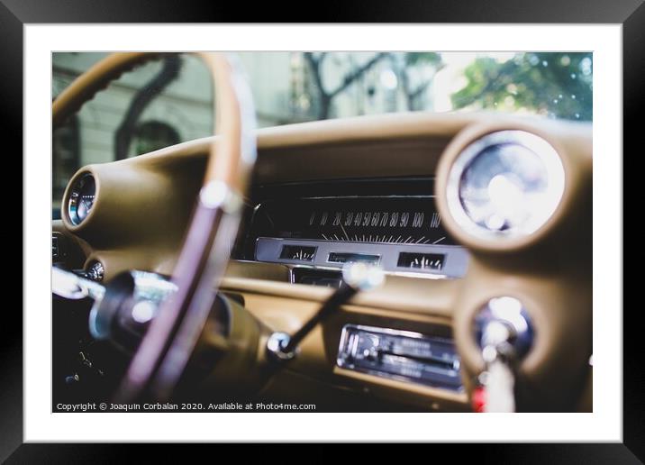Valencia, Spain - July 21, 2012: Dashboard and steering wheel of a luxury vintage car, an American Mustang. Framed Mounted Print by Joaquin Corbalan