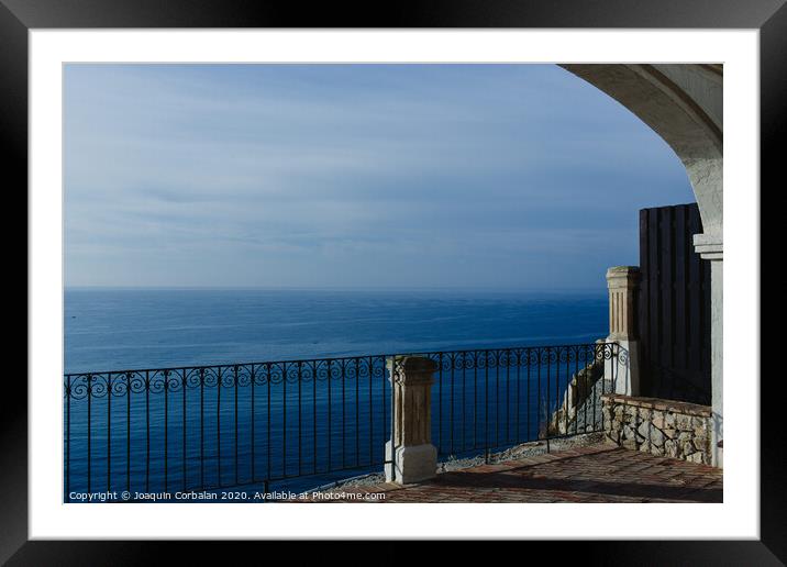 Calm blue sea without waves seen from a cliff with room for text Framed Mounted Print by Joaquin Corbalan