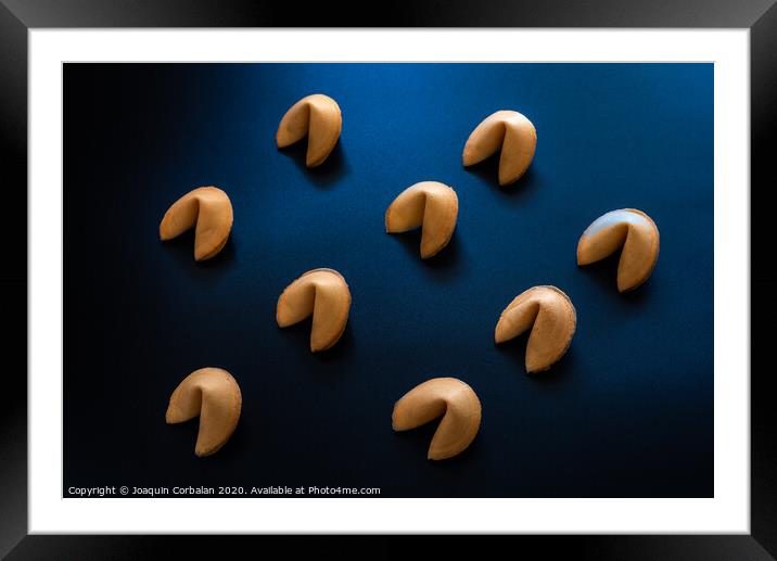 Fortune cookies on dark background arranged symmetrically Framed Mounted Print by Joaquin Corbalan