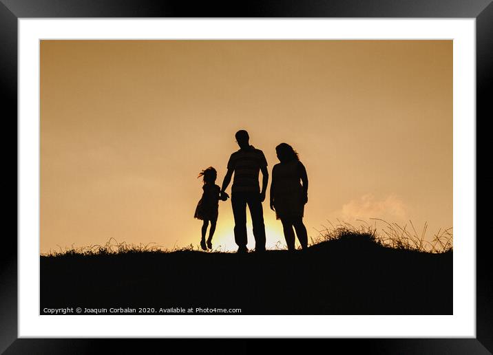 Couple with cloud sky backlight Framed Mounted Print by Joaquin Corbalan