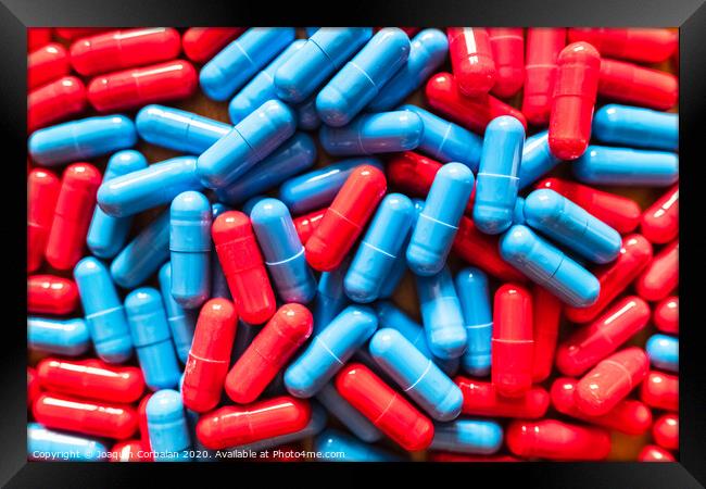Choosing between two options is difficult, many red and blue pills mixed to choose which one to take. Framed Print by Joaquin Corbalan