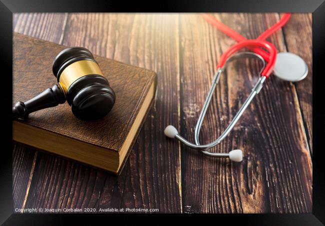 Gavel as a symbol of medical justice, applied by doctor judges, trend in 2020. Framed Print by Joaquin Corbalan