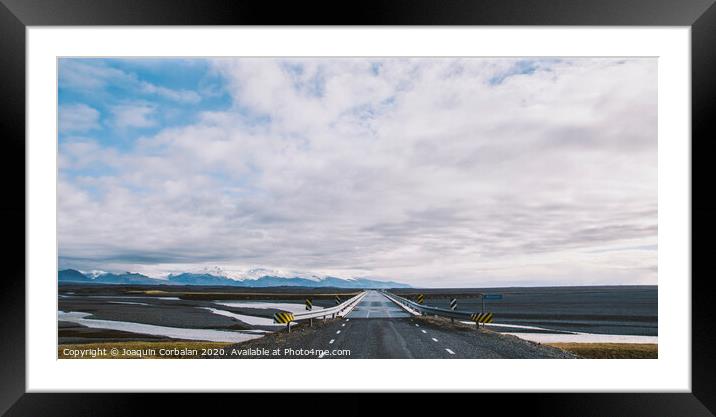 Icelandic lonely road in wild territory with no one in sight Framed Mounted Print by Joaquin Corbalan