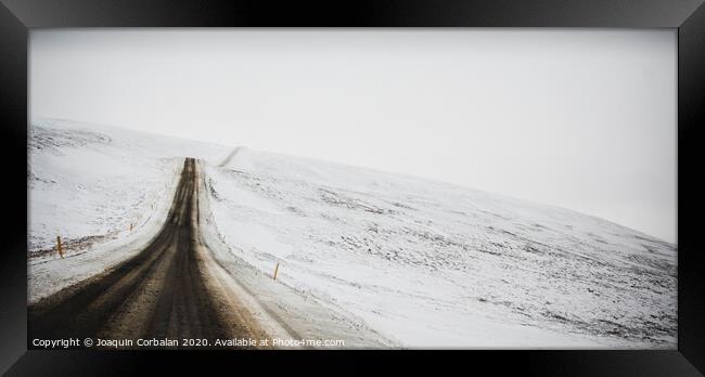 Road trip secondary with snow without anyone driving through Iceland Framed Print by Joaquin Corbalan
