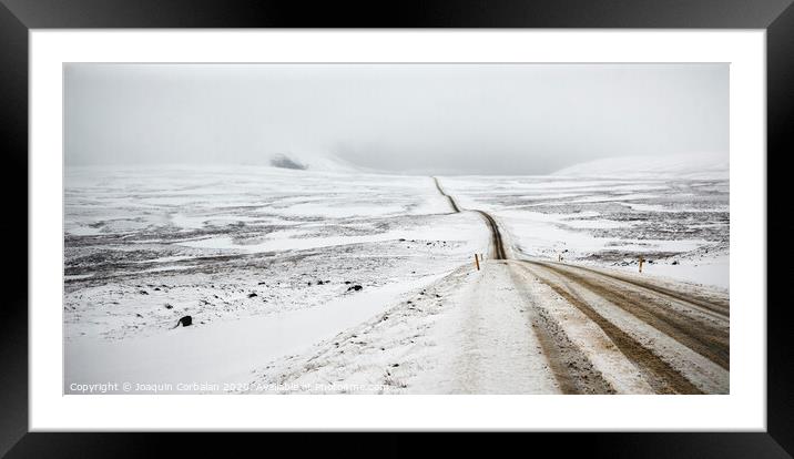 Road trip secondary with snow without anyone driving through Iceland Framed Mounted Print by Joaquin Corbalan
