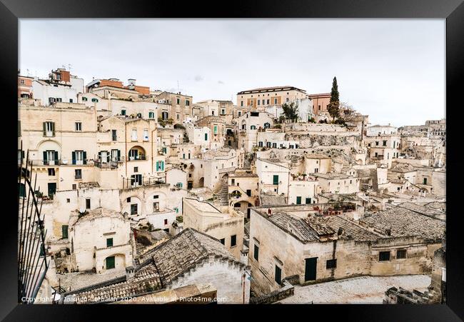 Long panoramic views of the rocky old town of Matera with its stone roofs. Framed Print by Joaquin Corbalan