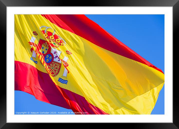 Close-up of the flag of Spain waving in the wind. Framed Mounted Print by Joaquin Corbalan