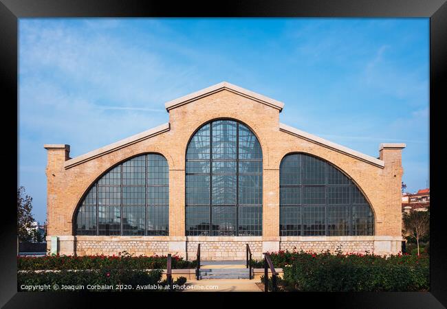 Valencia, Spain - December 30, 2019: Facade of the old train workshop factories in the Central Park of Valencia. Framed Print by Joaquin Corbalan