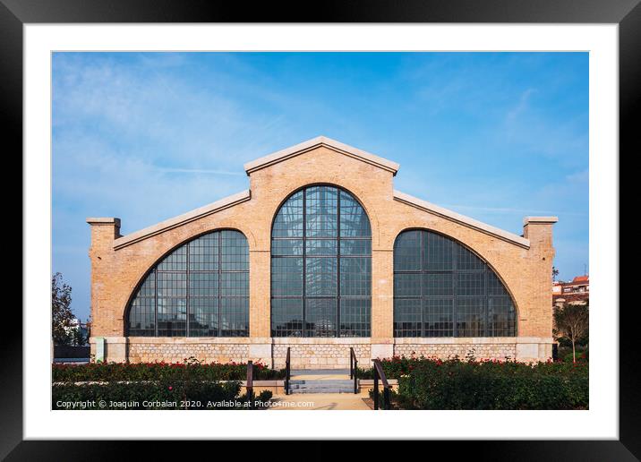 Valencia, Spain - December 30, 2019: Facade of the old train workshop factories in the Central Park of Valencia. Framed Mounted Print by Joaquin Corbalan