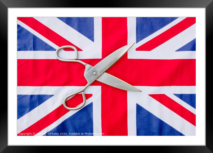 A woman cuts with scissors the British flag in protest. Framed Mounted Print by Joaquin Corbalan