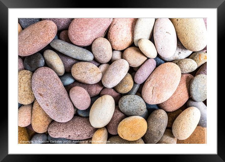 Round beach rocks to decorate the home. Framed Mounted Print by Joaquin Corbalan