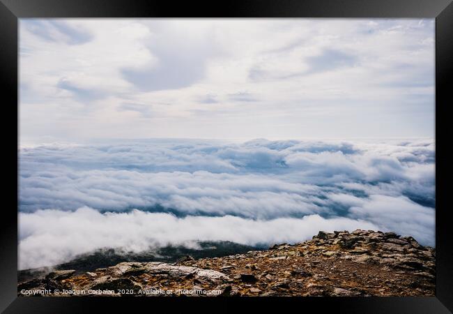 Mounds of rocks on the way to the ascent to the top of the mountain. Framed Print by Joaquin Corbalan